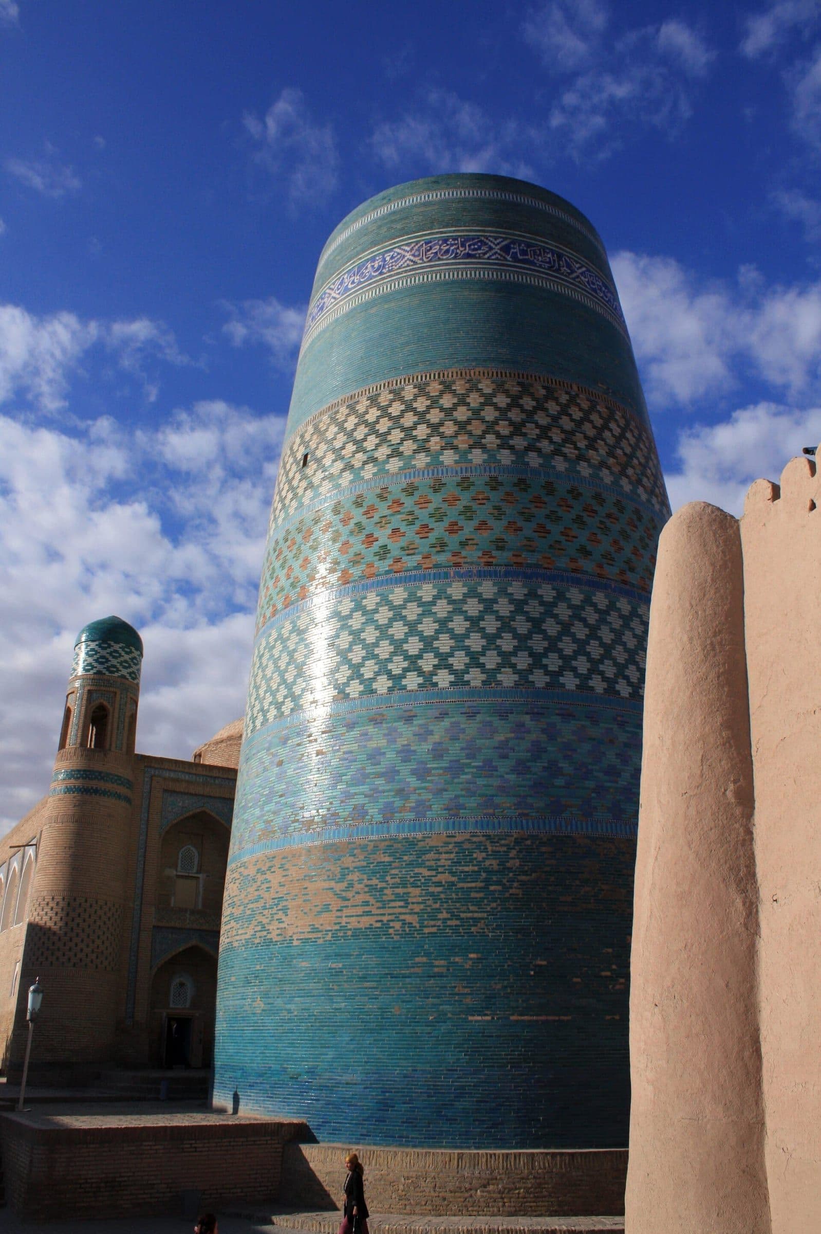 Kalta Minor in Khiva: a squat, unfinished minaret wrapped in bands of turquoise, blue and white glazed tiles